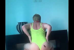 Sissy faggot Lupa dances and shows her ass with sexy tattoo. It is in a bright attire and a collar