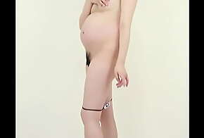 Pregnant woman trying to keep a photo of herself naked to commemorate her pregnancy.