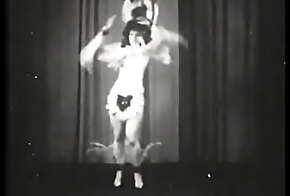 Retro whore performing strip dance on stage