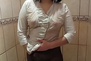 Girl upon a white blouse, upon black pantyhose masturbates upon the shower approximately orgasm.