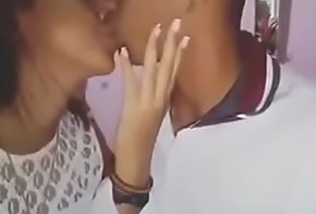 Indian boy giving a kiss his steady old-fashioned