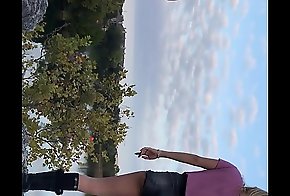 Gorgeous Blonde model with tiny shorts with perfect irritant posing be expeditious for pictures on a disquiet overlooking the lake